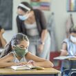 school students wearing masks to prevent covic