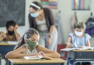 school students wearing masks to prevent covic